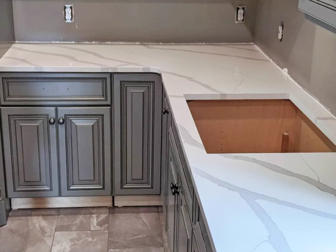 Calacatta-style quartz worktop being fitted